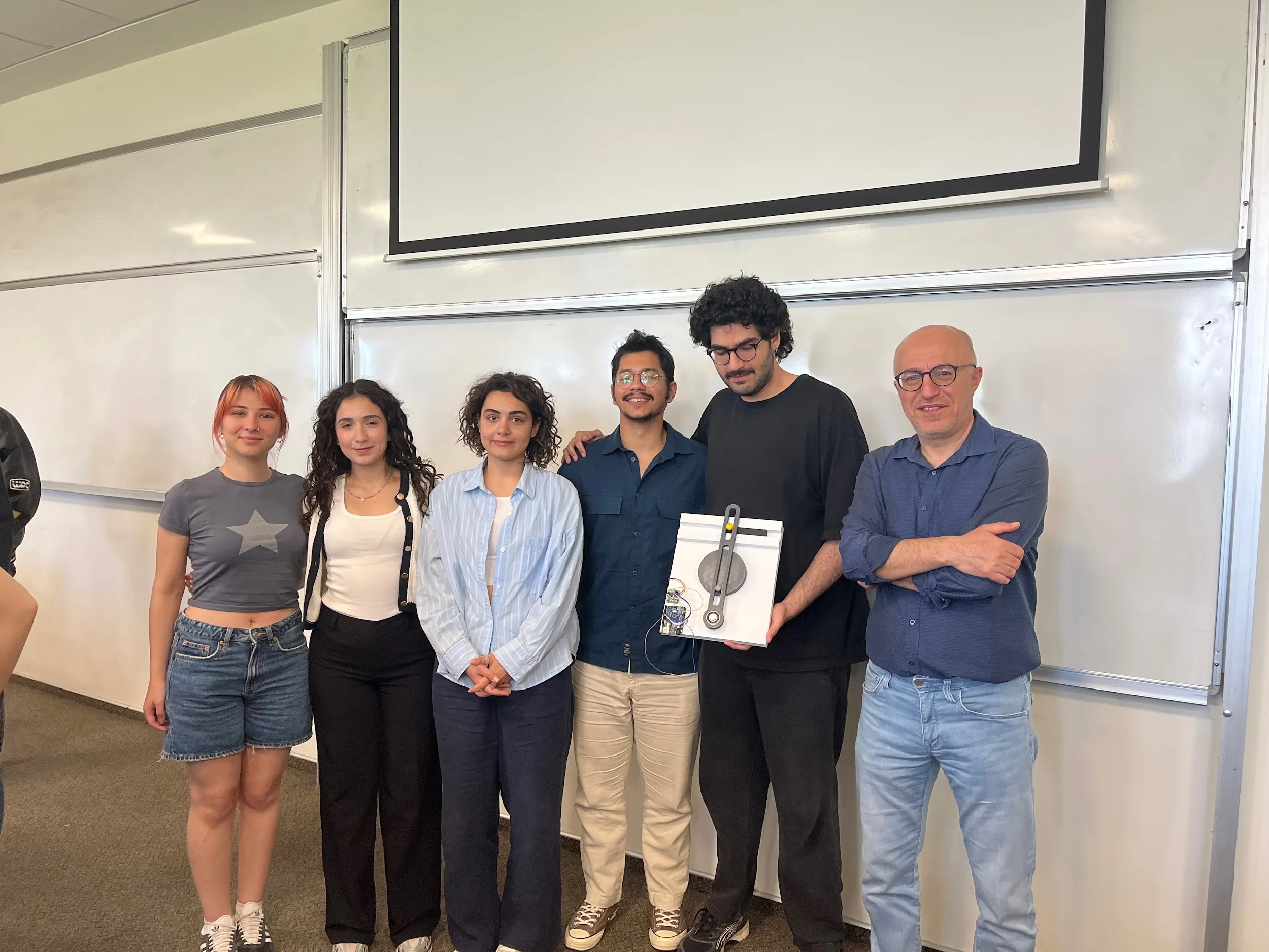 The five-person project team with the course TA